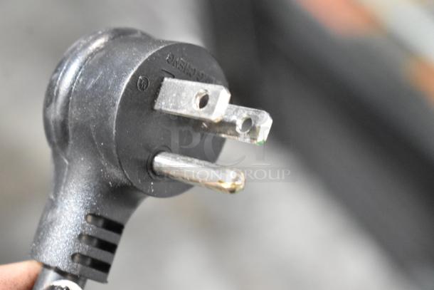 Close-up of a power plug for the 2021 True GDM-26-HC commercial cooler, 115V, 1 phase.