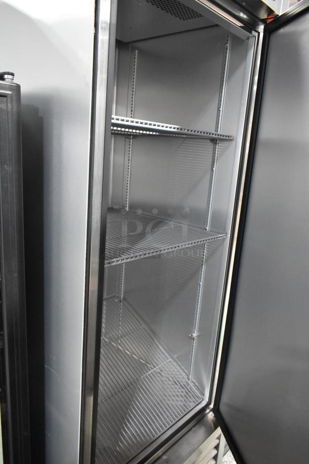 2024 True T-23-HC stainless steel single door cooler with poly-coated racks and commercial casters. 115V, 1 phase.