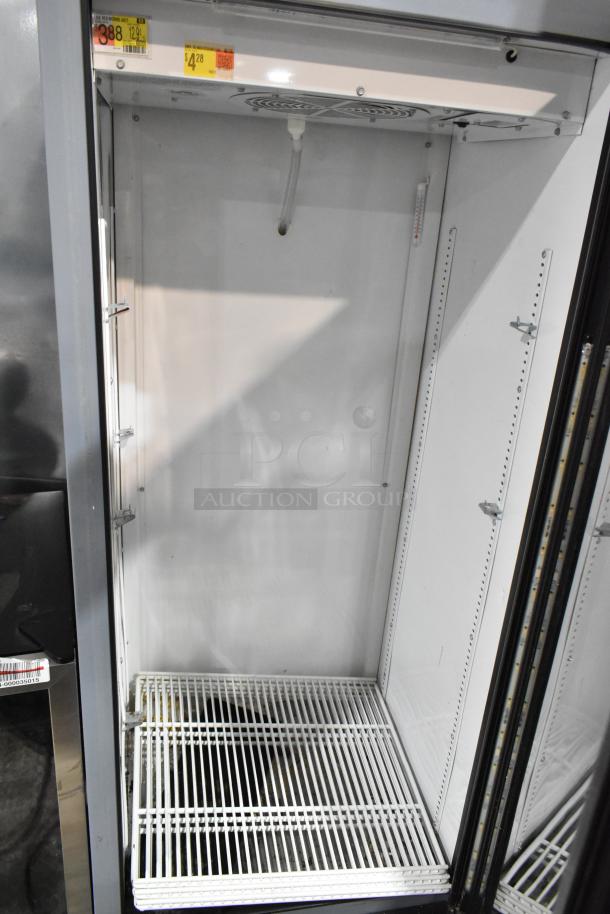 2017 True GDM-12-HC-LD single door cooler with poly-coated racks, metal frame, 115 volts, 1 phase. Clean interior, excellent condition.