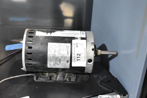 Interlink YSDK750-8C motor, 208-230/460 volts, 3 phase, used, with visible labels and mounting bracket.