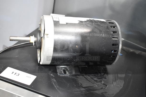 Interlink YSDK750-8C Motor, 208-230/460V, 3 Phase, used condition, visible mounting bracket and shaft, label partially visible.