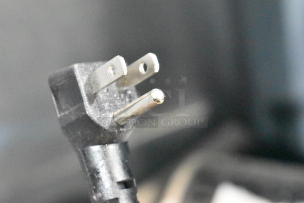 Close-up image of the plug for a Frigidaire Gallery FGMIS1260 mini cooler, 115 volts, 1 phase.