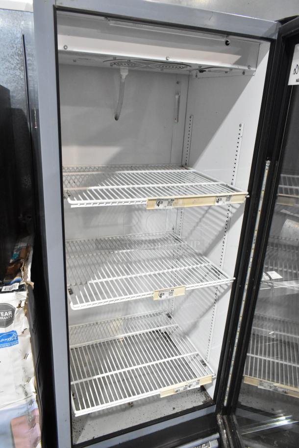 2018 True GDM-12-HC-LD cooler, metal commercial single door, poly coated racks, 115 volts, good condition.