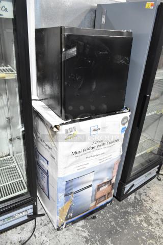 Two mini coolers: Hisense B95LE and Mainstays, 115 volts, 1 phase. Mainstays cooler in original box, good condition.