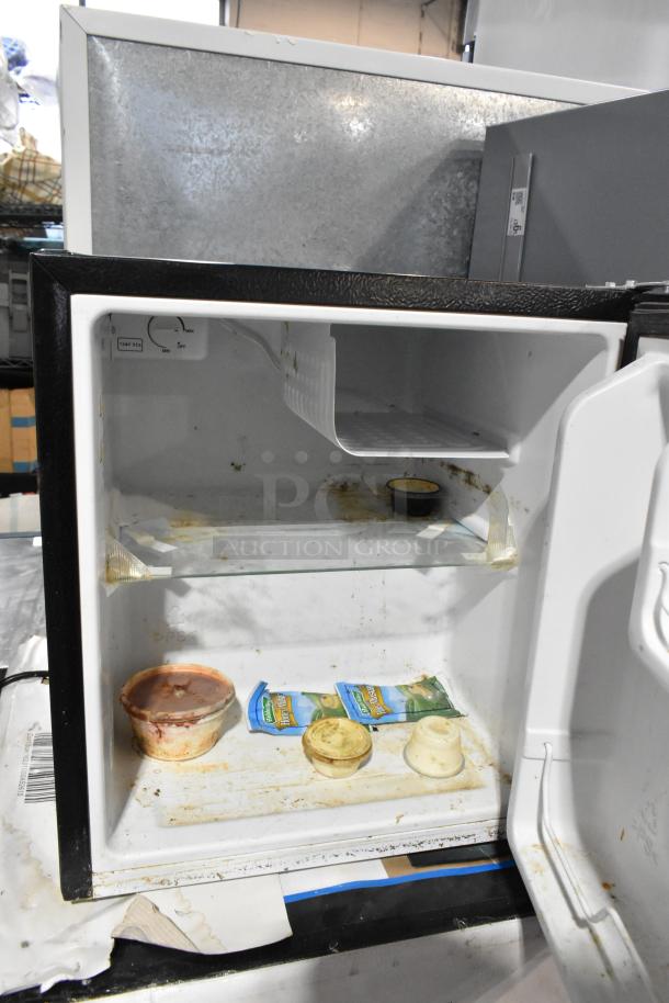 Two mini coolers including Hisense B95LE, Mainstays, 115 volts, 1 phase. Used condition, interior visible with shelves.