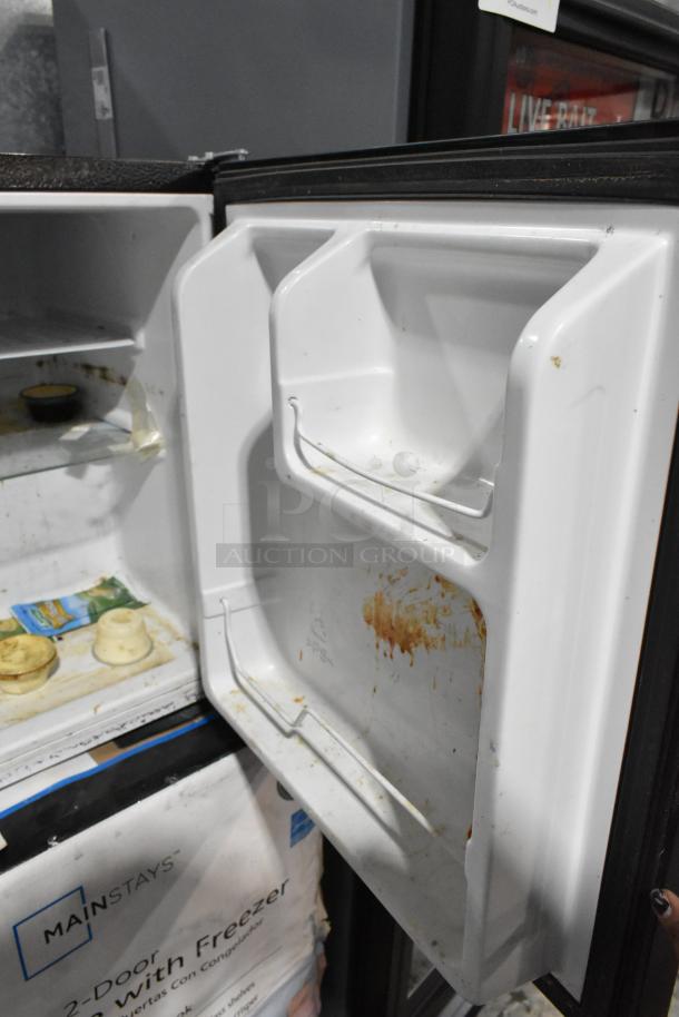 2 Mini Coolers including Hisense B95LE and Mainstays, 115 volts, 1 phase. Interior shows signs of use and wear.