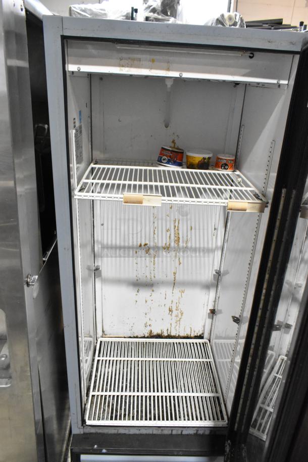 2021 True GDM-12-HC-LD single door cooler, metal, poly-coated racks, 115V, 1 phase, visible interior wear.