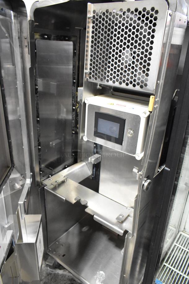 JBT Fresh N Squeeze stainless steel commercial citrus juicer, floor style with casters, 115V, 1 phase, touchscreen panel.