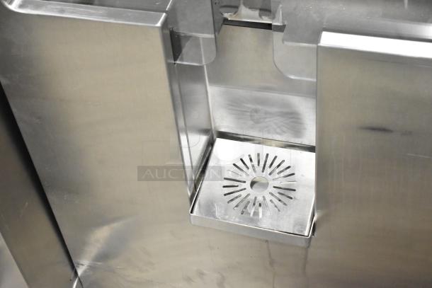 JBT Fresh N Squeeze stainless steel citrus juicer, commercial floor style on casters, 115V, 1 phase.