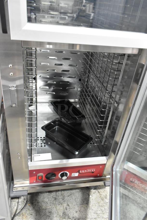 Brand new Avantco 177HTESDC1836 heated cabinet with clear Dutch doors, vacuum-insulated, on commercial casters.
