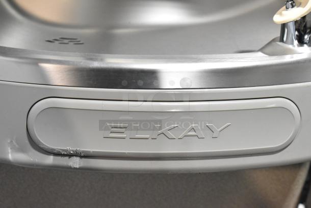 BRAND NEW SCRATCH AND DENT Elkay stainless steel 2-tier water fountain with bottle filler, minor abrasions visible.