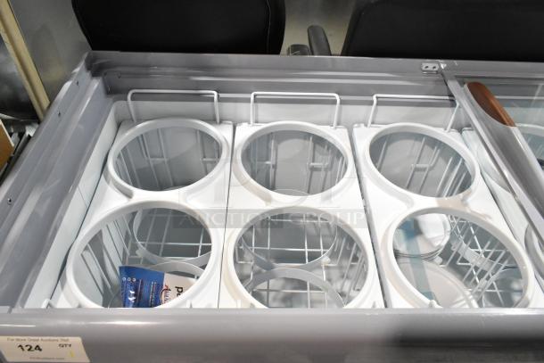 Brand new Avantco 360ADC12N 71" metal ice cream dipping cabinet with tub collars. Scratch and dent condition. 115 volts, 1 phase.