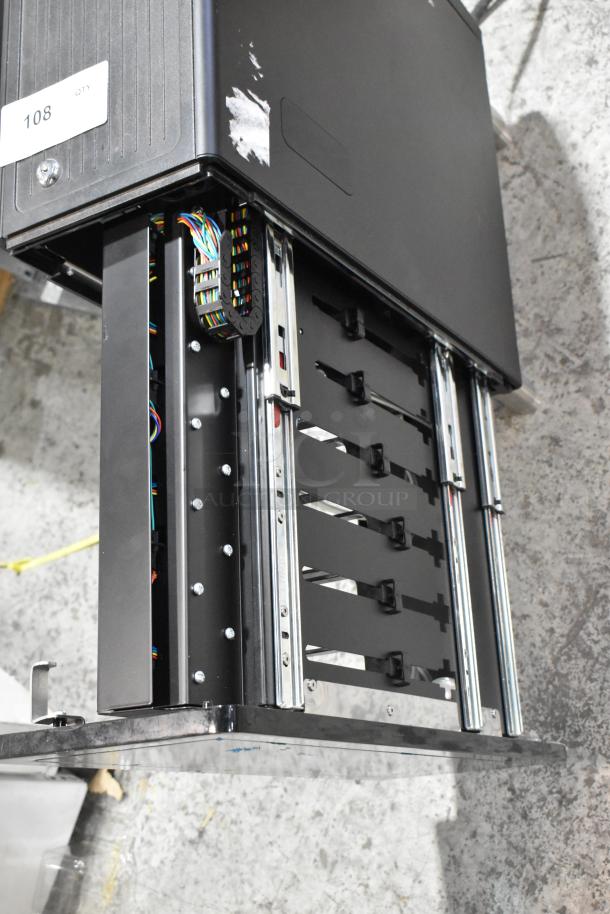 Metal flavor dispenser with multiple sliding tracks, wiring visible, and minor surface wear. Serial number tag: 108.