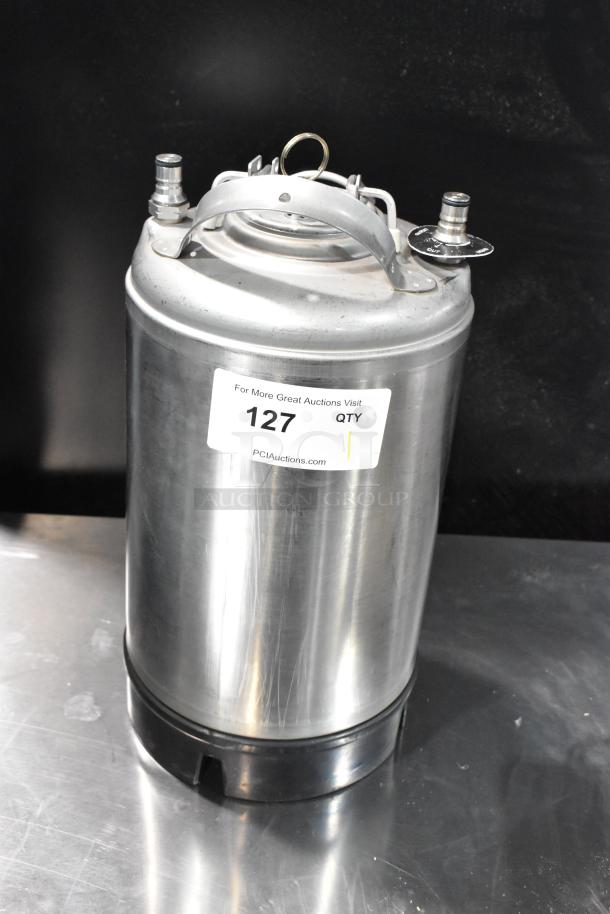 Metal homebrew keg, silver, with top handles and fittings. Auction label "127" affixed. Polished finish, good condition.
