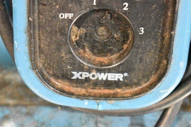 Xpower P-230AT Blue Air Mover, 120V, showing control dial with settings and visible wear. Model name and brand marked.