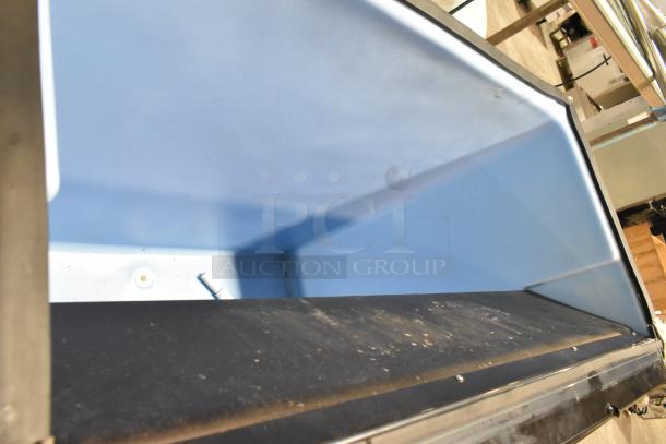 2024 Ice-O-Matic B110PSB Stainless Steel Commercial Ice Bin, shown open, featuring durable blue interior.