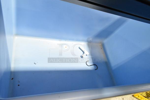 2024 Ice-O-Matic B110PSB stainless steel commercial ice bin interior, showing light use, with a few small parts inside.
