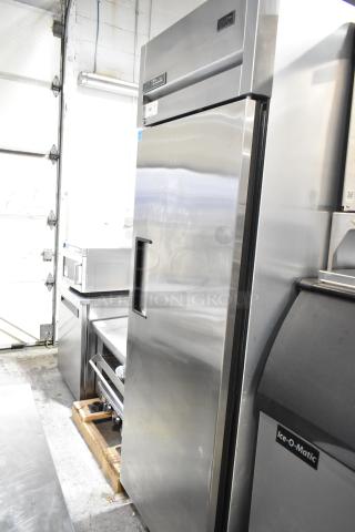 True TG1R-1S-HC stainless steel commercial reach-in cooler with single door, poly-coated racks, on casters, like new.