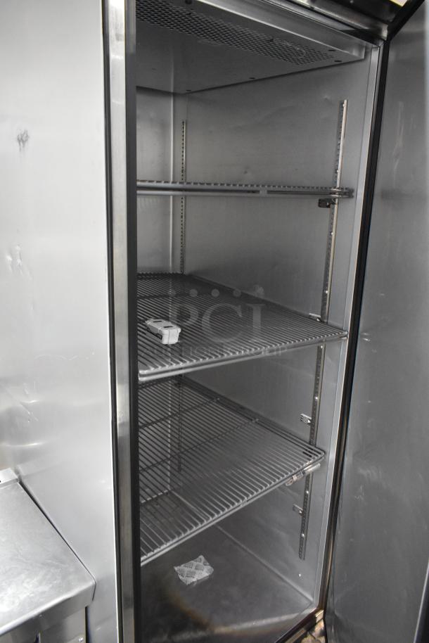 2023 True TG1R-1S-HC stainless steel commercial cooler with poly-coated racks, on casters. 115V, 1 phase. Pristine condition.