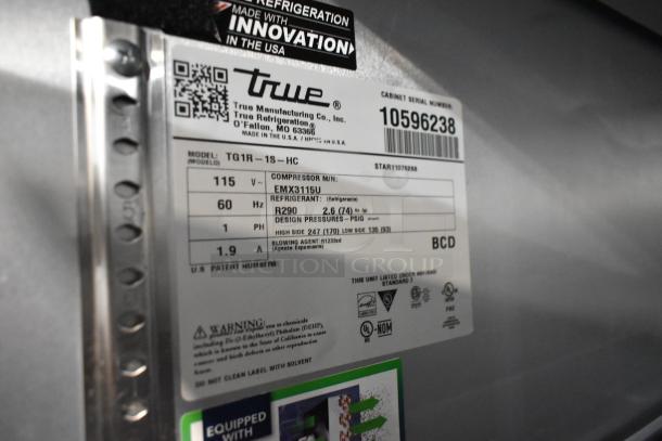 Label for 2023 True TG1R-1S-HC cooler, showing model, voltage, and refrigerant specs. Stainless steel, commercial use.