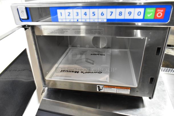 Brand new 2025 Solwave SWAHD18 stainless steel commercial microwave, push button controls, 208/240V, 1 Phase, with manual inside.