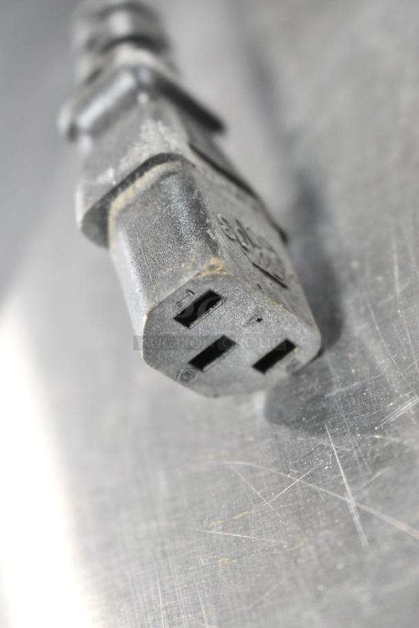 Close-up of a power plug on a 2021 Automatic Bar Controls JT-NITCOM-R Nitro Dispenser, stainless steel, 115 volts, 1 phase.