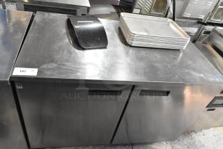 2018 Delfield UC4048P-STAR stainless steel undercounter cooler, 2-door, 115V, good condition, auction tag visible.