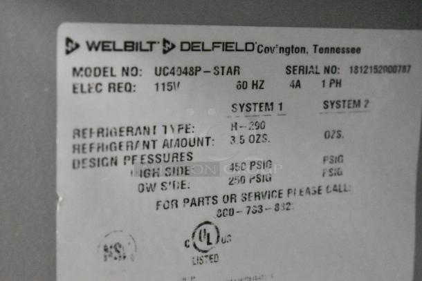 Label for 2018 Delfield UC4048P-STAR stainless steel undercounter cooler, showing model number, voltage, refrigerant type, and pressures.