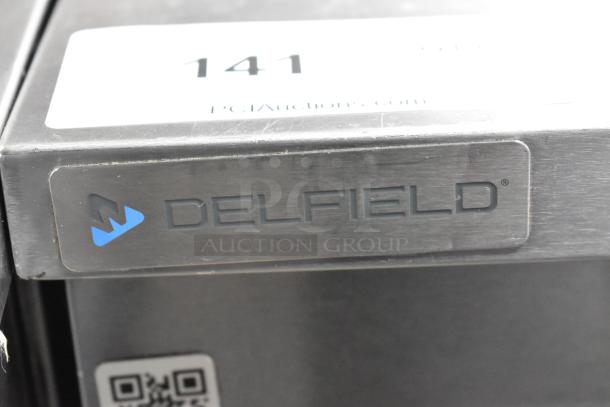 2018 Delfield UC4048P-STAR stainless steel undercounter cooler, two doors, 115V, logo plate visible, good condition.