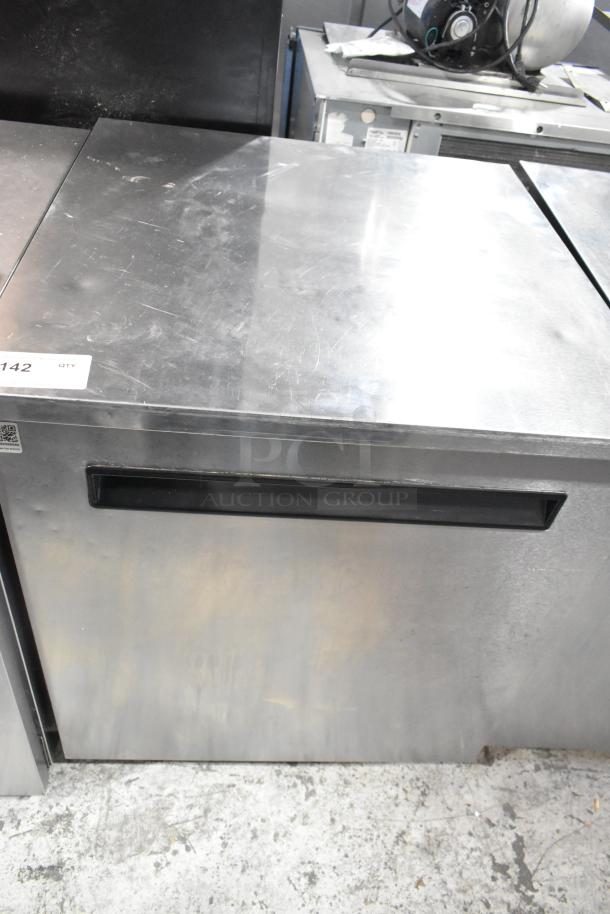 Delfield 406-STAR2 stainless steel single door undercounter cooler, 115 volts, 1 phase, visible scuffs on surface.