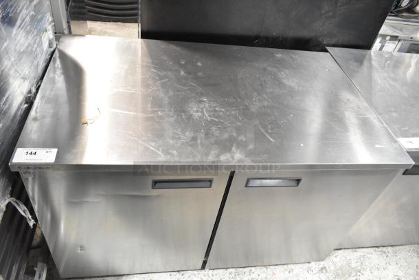 Delfield stainless steel 2-door undercounter cooler, 115 volts, 1 phase, used condition with visible surface marks.