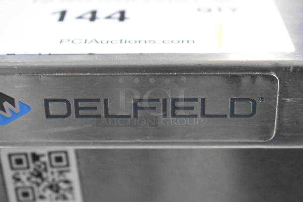 Delfield stainless steel 2-door undercounter cooler, 115 volts, 1 phase, commercial use, PCI Auctions label visible.