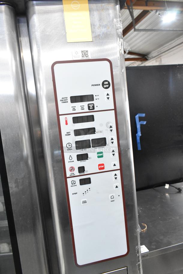 Baxter stainless steel commercial electric mini rotating rack oven with control panel, on double pan rack.