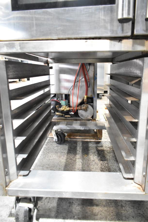 Baxter stainless steel mini rotating rack oven on double pan rack, electric powered, visible internal components, commercial use.