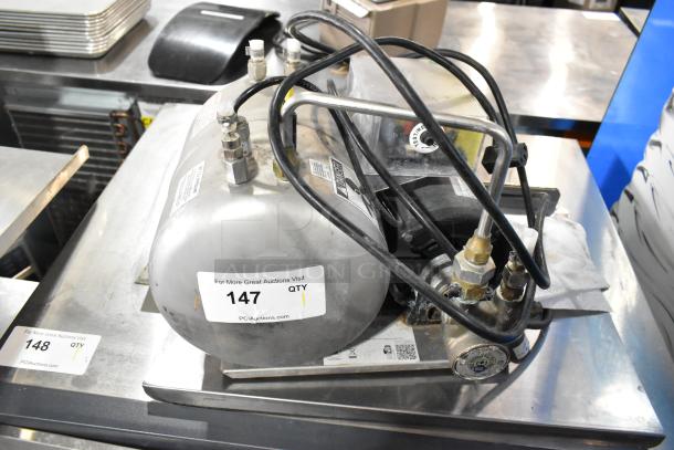 2016 Lancer 205 Carbonator, stainless steel, compact design, visible control knobs, intact condition, auction tag on side.