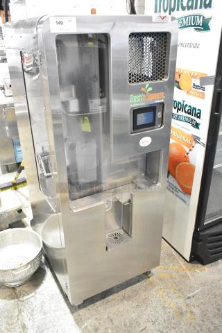 LATE MODEL JBT 2ND-GEN-MFJ-HE stainless steel commercial citrus juicer, floor style, on casters, 115V, 1 phase, Fresh N Squeeze branding.