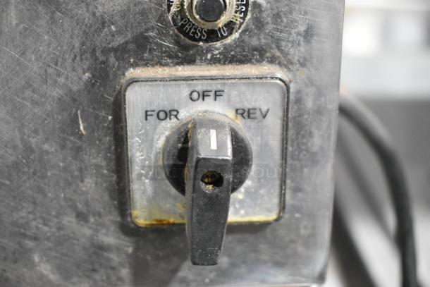 Globe CM22 stainless steel meat grinder base, featuring a control dial with off, forward, and reverse options. Appears used.