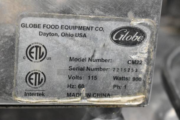 Globe CM22 stainless steel meat grinder base with label. Model CM22, 115 volts, 900 watts, phase 1, made in China.