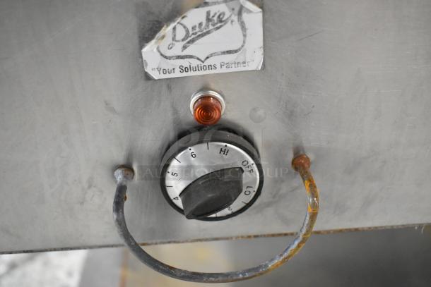 Duke EP304 Aerohot metal steam table control panel with temperature dial and indicator light, showing some wear.