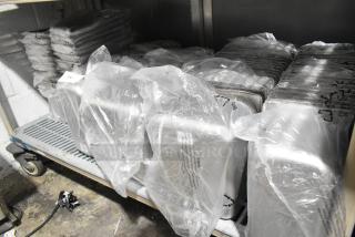 Various stainless steel drop-in bins on a cart, covered in plastic. Includes models 4070269 and 4070369.