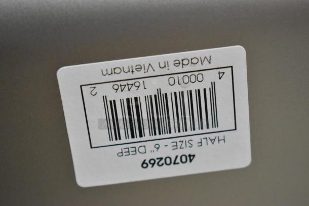 Label on stainless steel bin displaying barcode, model 4070269, marked "Made in Vietnam," indicating half size, 6" deep.