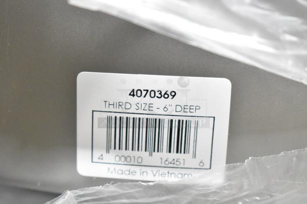 Stainless steel drop-in bin, model 4070369, third size, 6" deep, made in Vietnam, barcode visible.