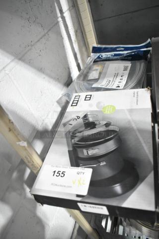 Two items on a shelf: T&S B-0425-KIT inlet supply nipple kit in package, A-529 rack in box with visible auction label.