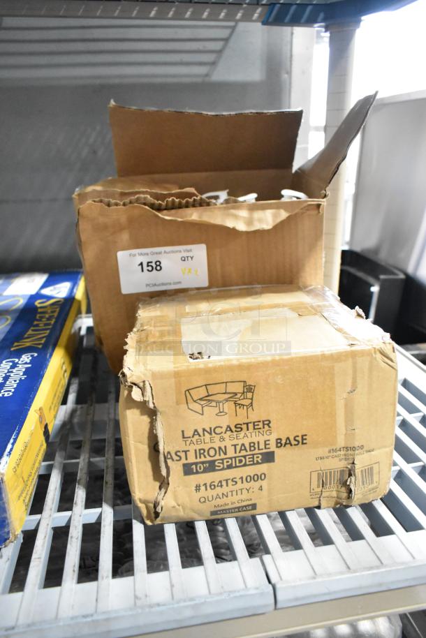 New Lancaster 164TS1000 cast iron table base in damaged box. Includes Soap Sea Conditioner. Auction label visible.