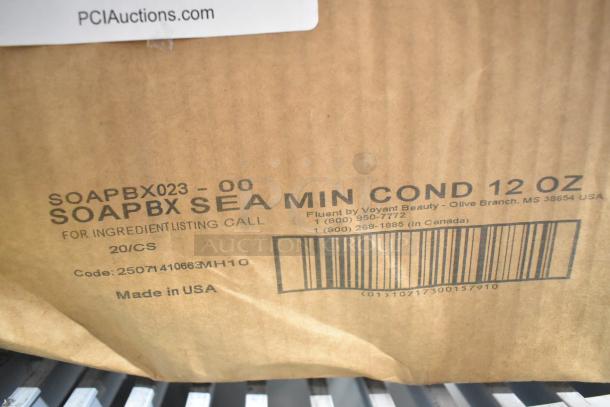 Cardboard box with label "SOAPBX SEA MIN COND 12 OZ," made by Voyant Beauty, Olive Branch, MS. Includes barcode and contact info.