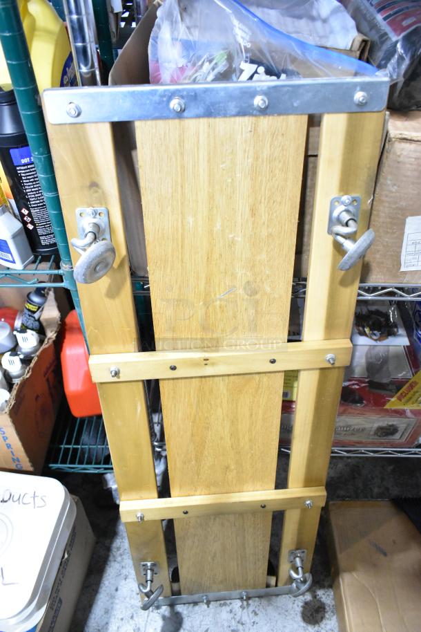 Craftsman Heavy Duty Creeper in wood and metal, featuring adjustable wheels. Includes Struts Sawhorse and Scraper.