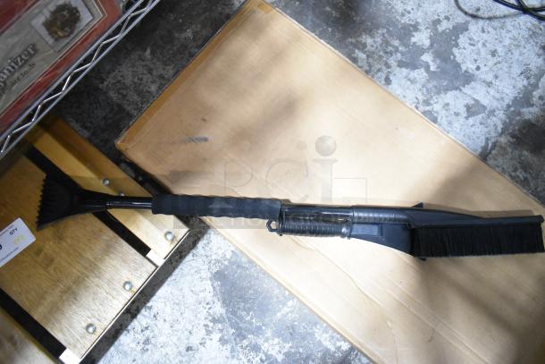 Craftsman Heavy Duty Creeper, Struts Sawhorse, and Scraper on floor. Includes brush and handle; tag shows item details.