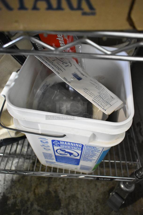 Tier lot including ladder dolly, rolling tool organizer, toilet pipe extender in a storage rack. Visible warning label.