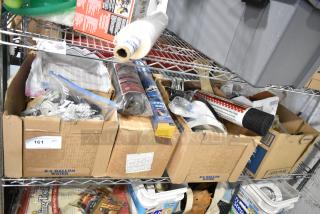 Tiered lot of assorted items including file folders, plastic sheeting, doorknob, outlet covers; various conditions.