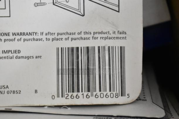 Barcode and warranty information on packaging for outlet covers, featuring installation diagram and return instructions.